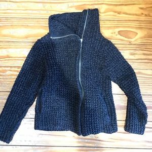 Woman’s sweater jacket.